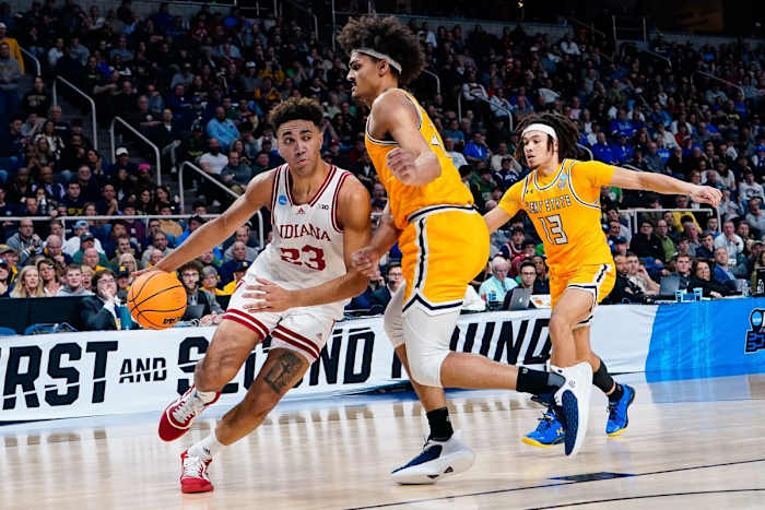 Trayce Jackson-Davis (23) controls the ball as Kent State Golden Flashes forward Chris Payton (4) guards.